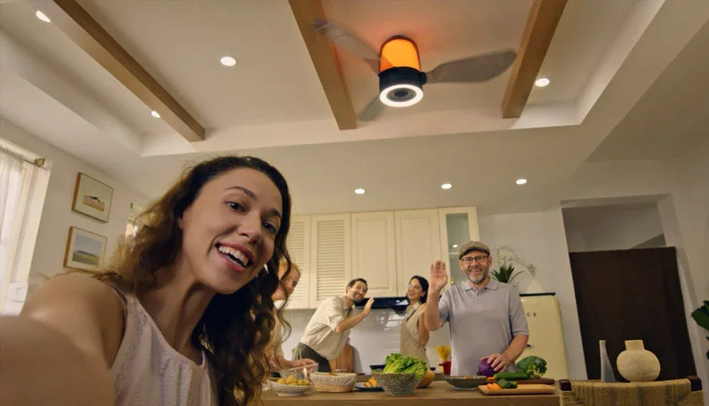 Friends gathering beneath AirFi One in a bright kitchen